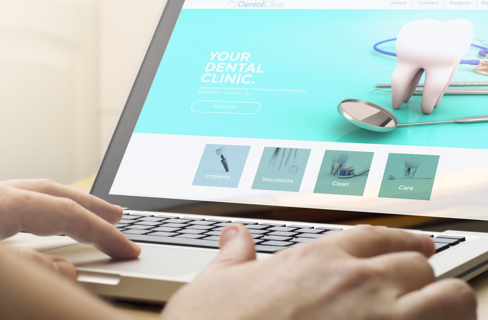Dental professional working on their website